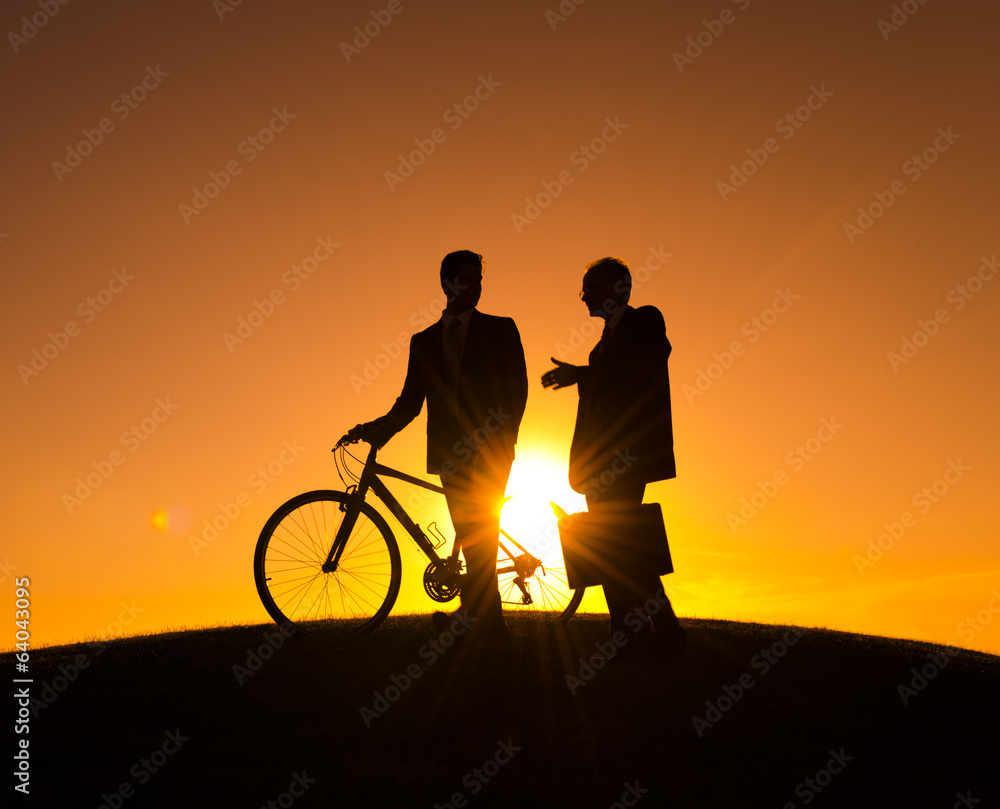 Fototapeta premium Businessmen on the Way During Sunset