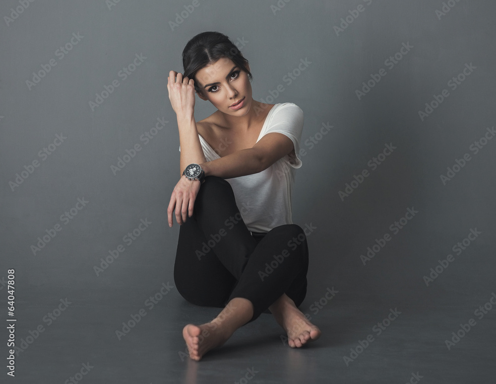 Studio portrait of young on the grey backgroung Studio portrait of young on the grey backgroung