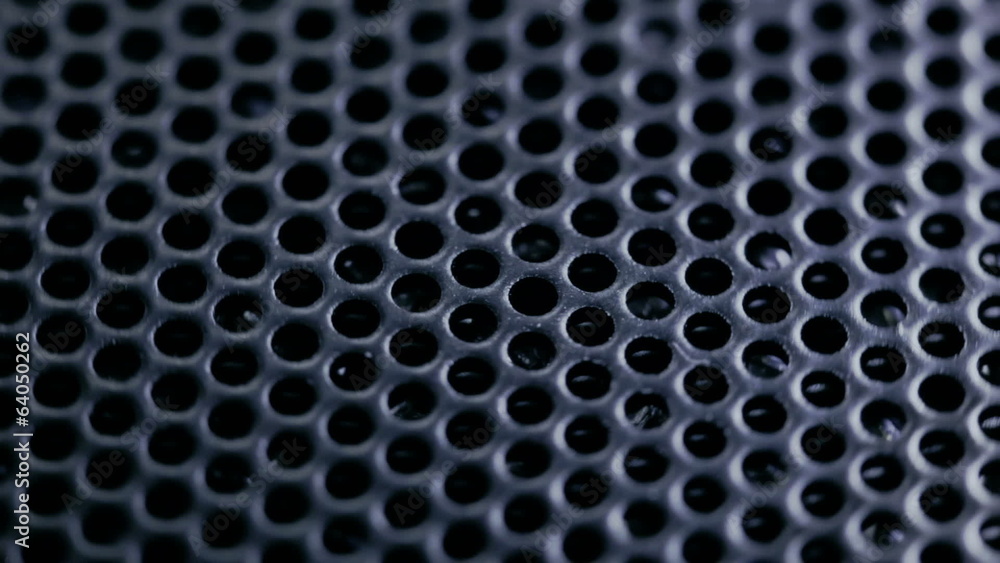Dark metal lattice rotates. Macro. Dark metal lattice rotates. Macro.