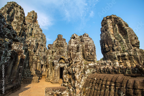 Stone faces on the towers of ancient Bayon Temple in Angkor Thom