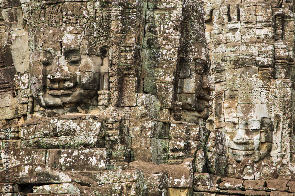 Stone faces on the towers of ancient Bayon Temple in Angkor Thom Stone faces on the towers of ancient Bayon Temple in Angkor Thom