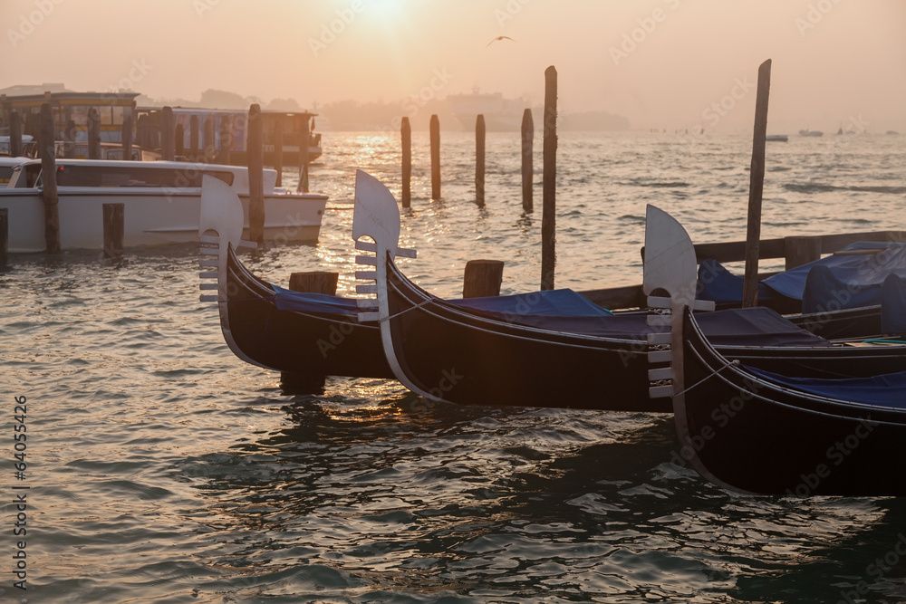 Venetian gondolas at sunrise in Venice