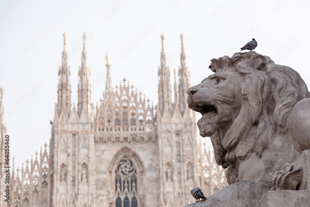 Lion statue in Milano and cathedral