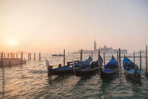 Venetian gondolas at sunrise in venice