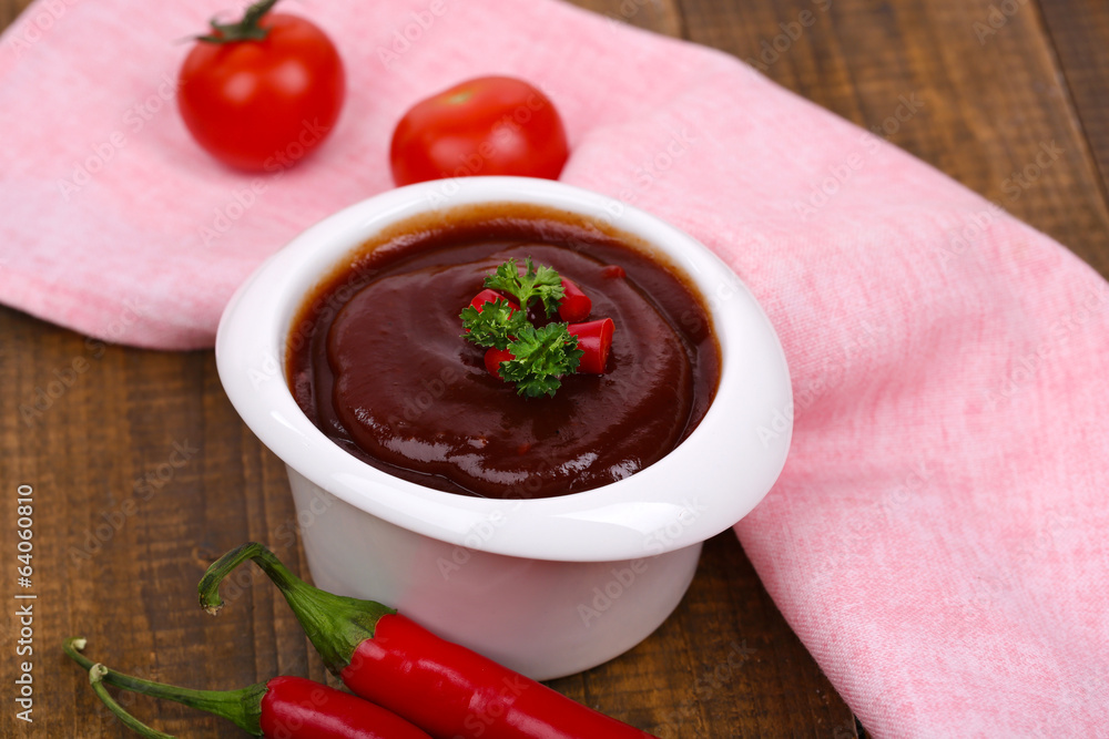 Tomato sauce in bowl on wooden table close-up Tomato sauce in bowl on wooden table close-up