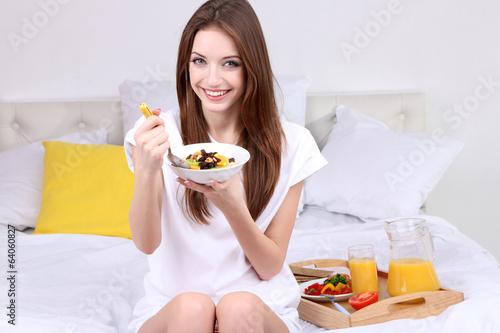 Young beautiful woman on be...