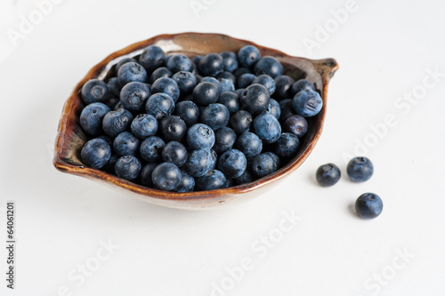 Blueberry in bowl on white