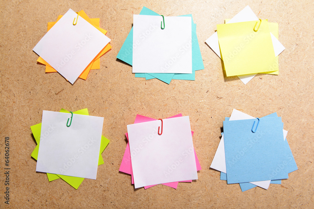 Empty paper sheets on wooden background Empty paper sheets on wooden background