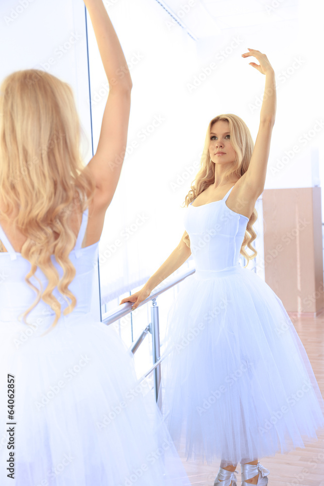 Fototapeta premium Beautiful balerina practicing in ballet class