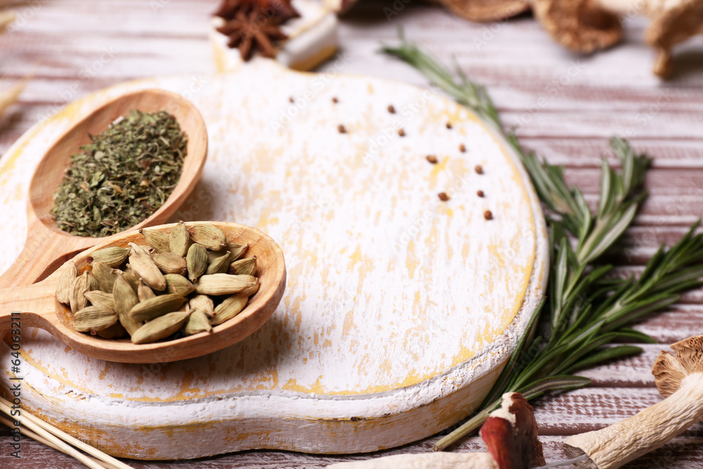 Different spices and cutting board, close up