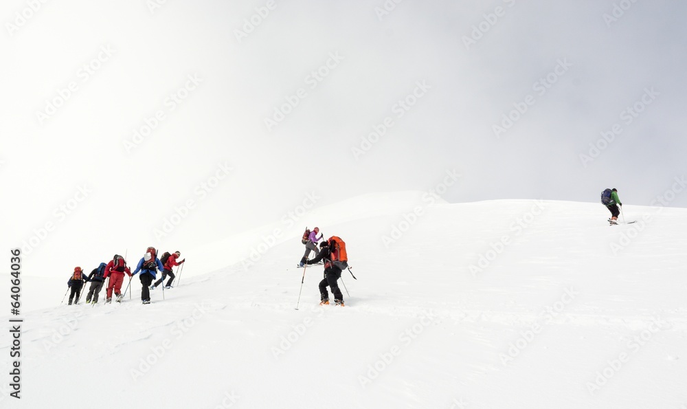 Backcountry skiers ascending a mountain