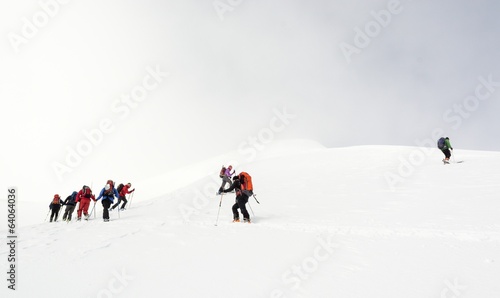 Backcountry skiers ascending a mountain