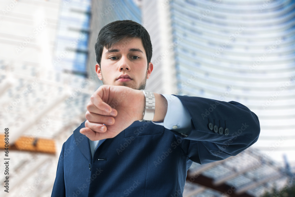 Businessman looking at his watch Businessman looking at his watch