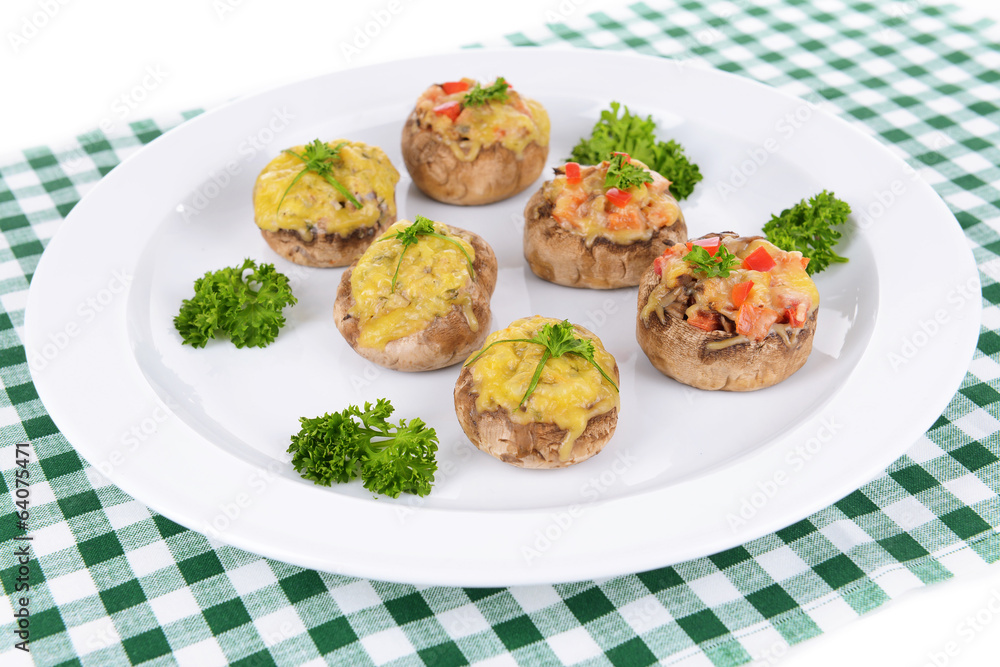 Stuffed mushrooms on plate on table close-up Stuffed mushrooms on plate on table close-up