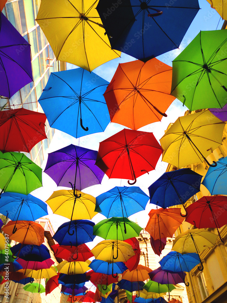 A lot of multicolored umbrellas over the sky