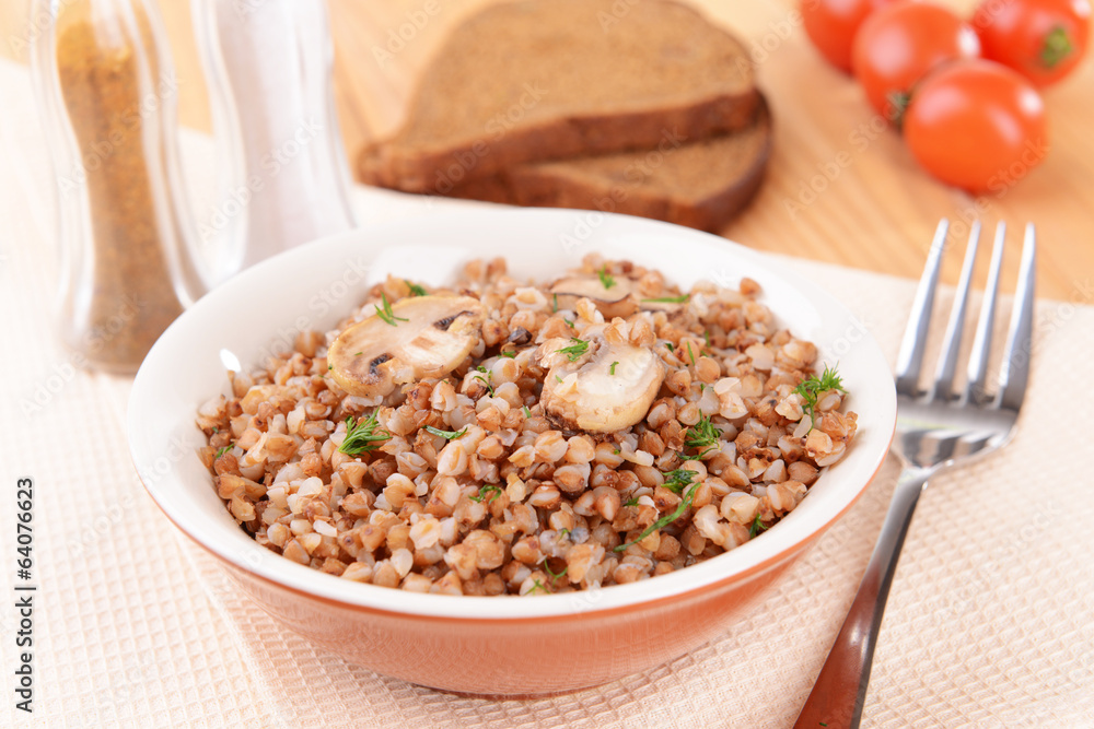 Boiled buckwheat in bowl on table close-up Boiled buckwheat in bowl on table close-up