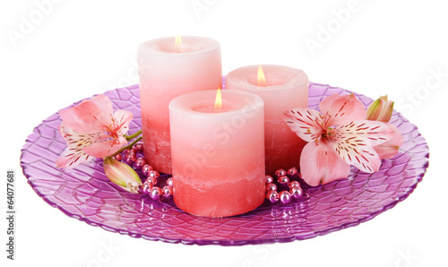 Beautiful candles with flowers isolated on white