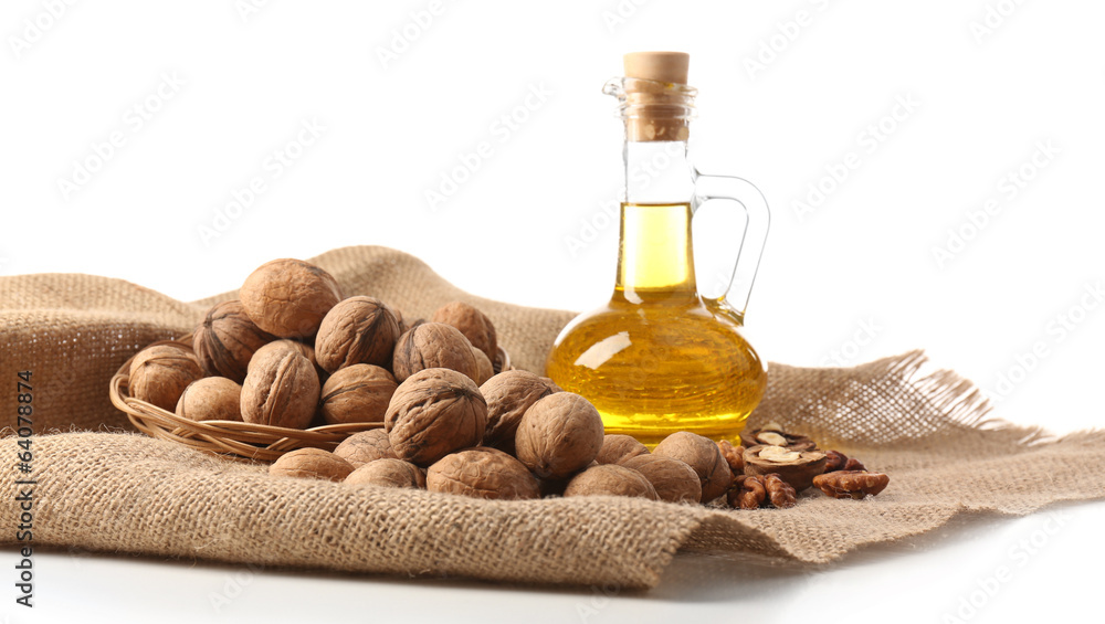 Walnut oil and nuts, isolated on white Walnut oil and nuts, isolated on white