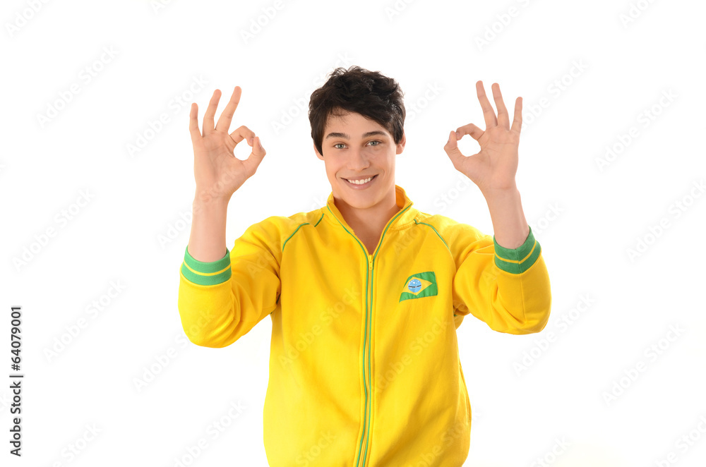 Brazilian man signing ok or zero. Happy Brazil football fan.