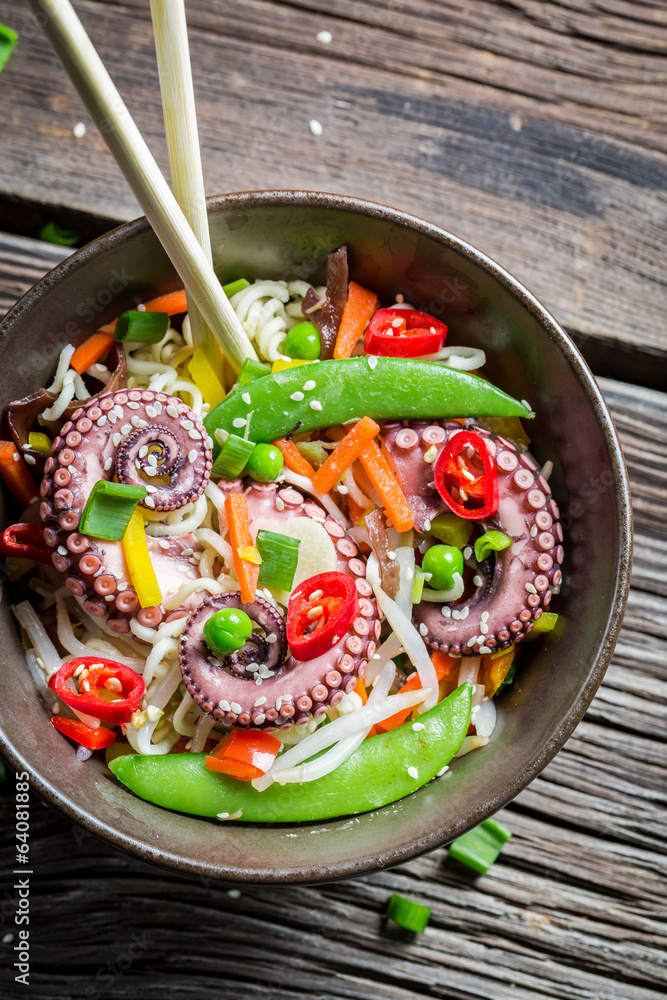 Octopus with vegetables and noodles