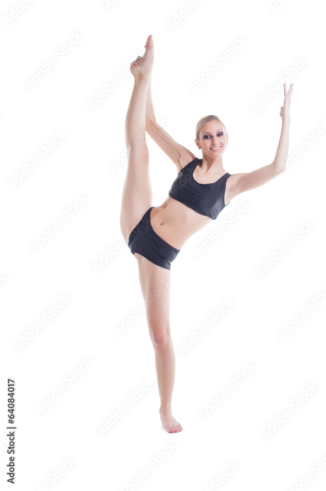 Cheerful young blonde doing stretching exercises