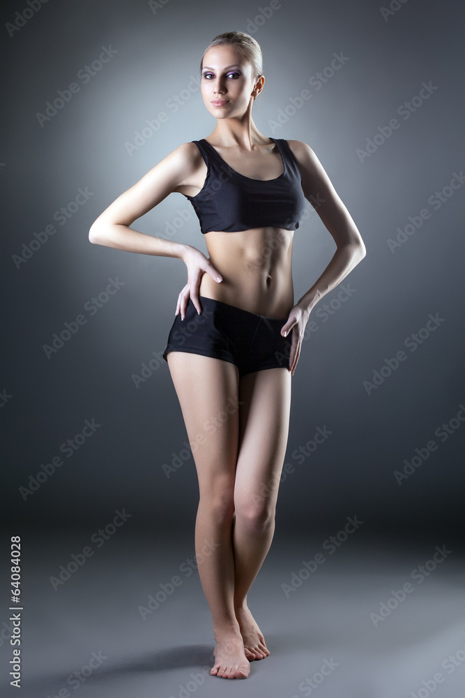 Image of comely sporty woman posing at camera