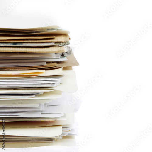 Stacks of files in folders on white. Filing photo