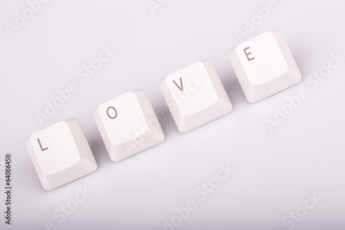 text love formed with computer keyboard keys on white background