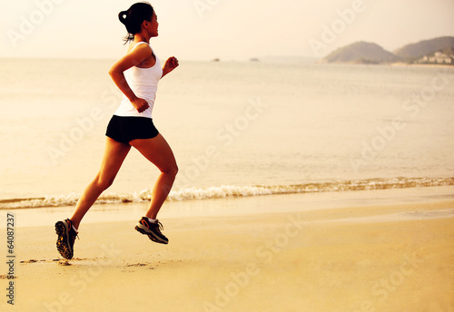 Runner athlete running at seaside 