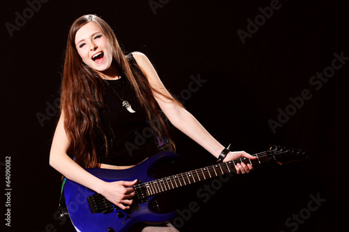 Female rock star playing the guitar