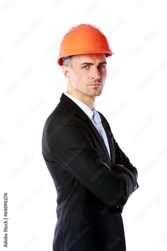 Handsome businessman in helmet standing with arms folded Handsome businessman in helmet standing with arms folded