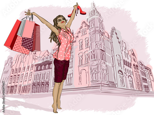 Fashion girl with shopping bags on a city-background