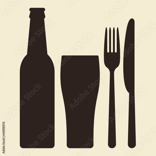 Bottle, glass of beer and cutlery