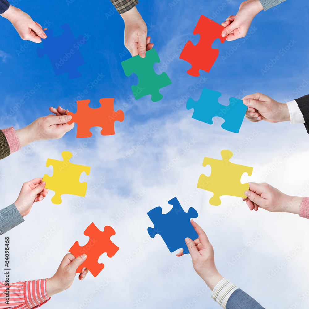 people hands with puzzle pieces with white cloud people hands with puzzle pieces with white cloud
