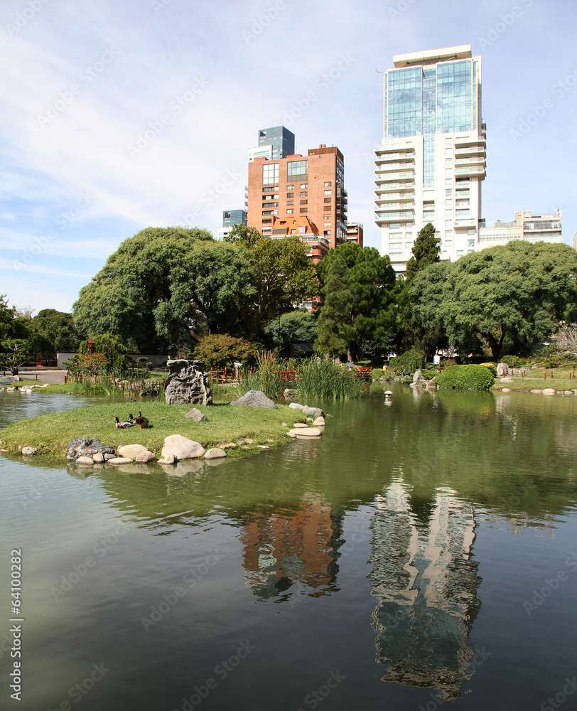 Green Japanese garden in the modern city.