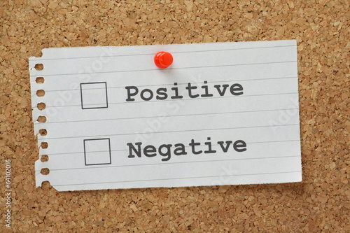 Positive or Negative tick boxes on a cork notice board