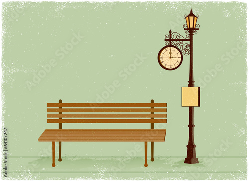 Street clock and lamp post with park bench