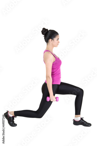 Pretty young woman training with dumbbels