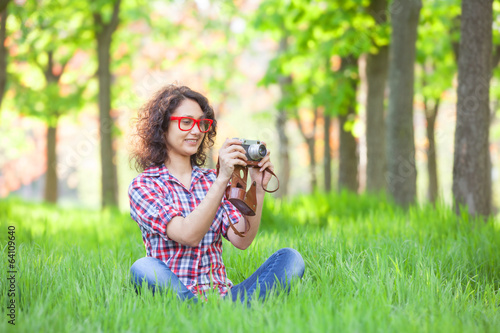 Photography Indian girl with camera in the park.