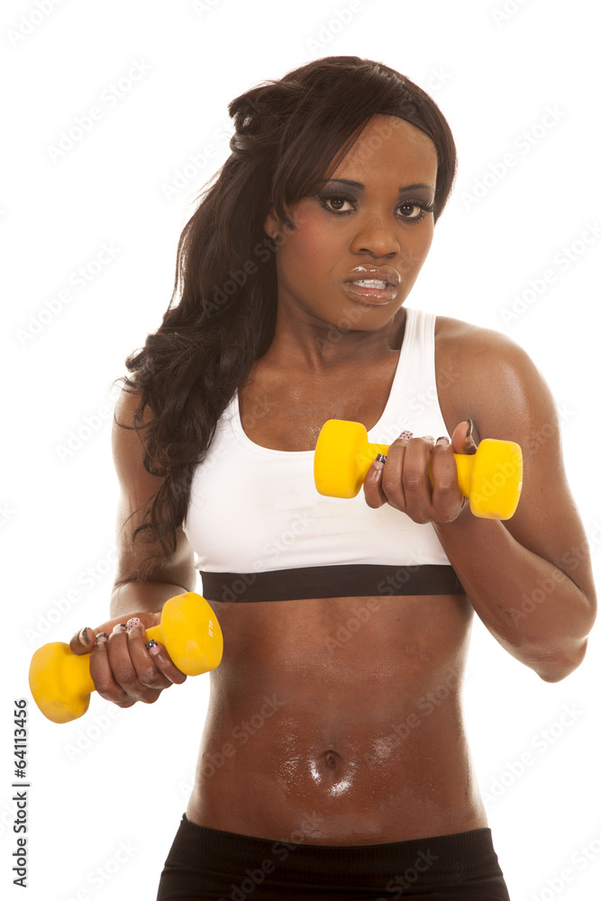 African American woman fitness white bra close yellow weights African American woman fitness white bra close yellow weights