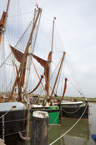 old thames sailing barges moored in dock at maldon, essex, uk