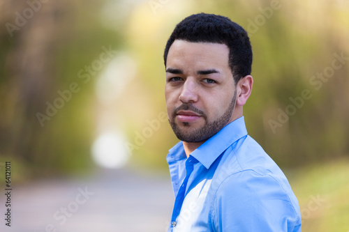 Outdoor portrait of a young latin american man
