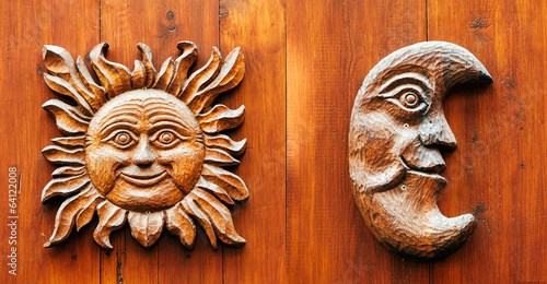 Bilde på lerret Ancient door with Moon and Sun face carved from wood