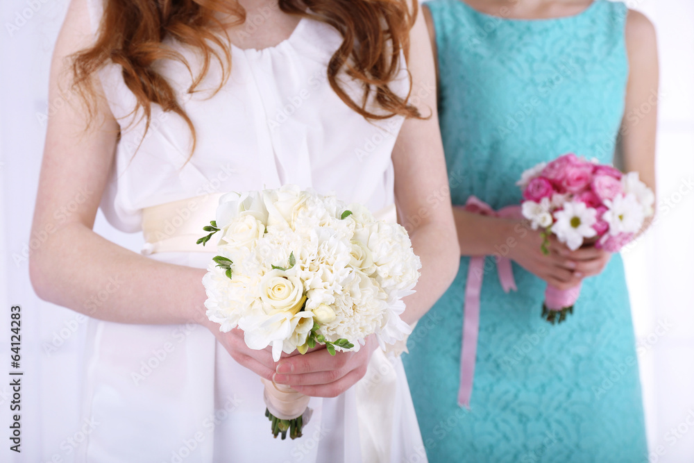 Woman hands holding beautiful wedding bouquet Woman hands holding beautiful wedding bouquet