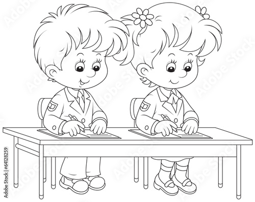 Schoolchildren writing at a lesson