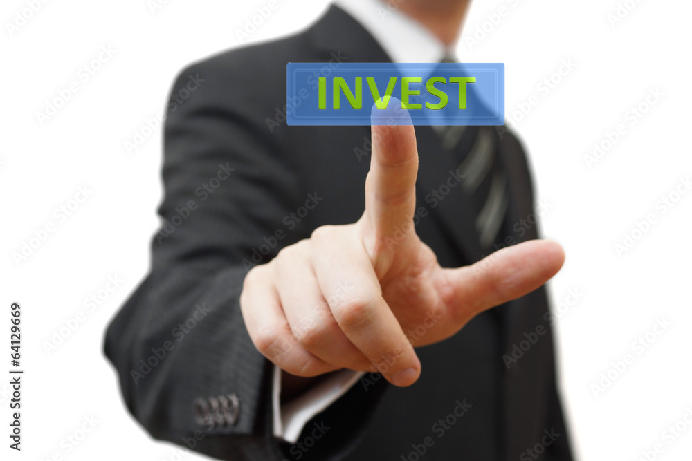 Businessman touching virtual display with Invest word. Isolated Businessman touching virtual display with Invest word. Isolated