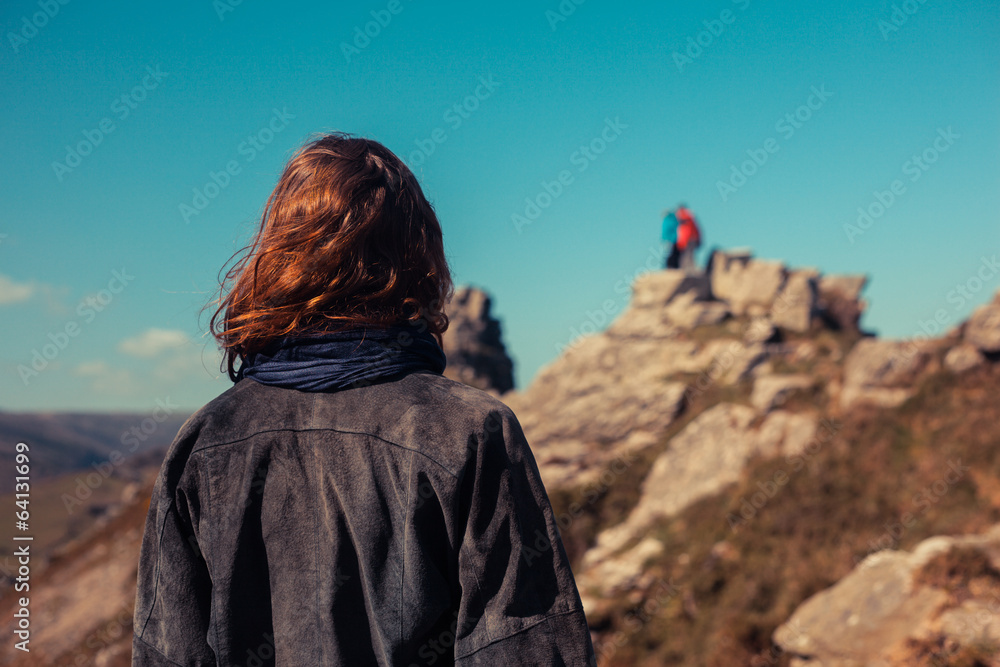 Young woman trekking in the mountains Young woman trekking in the mountains