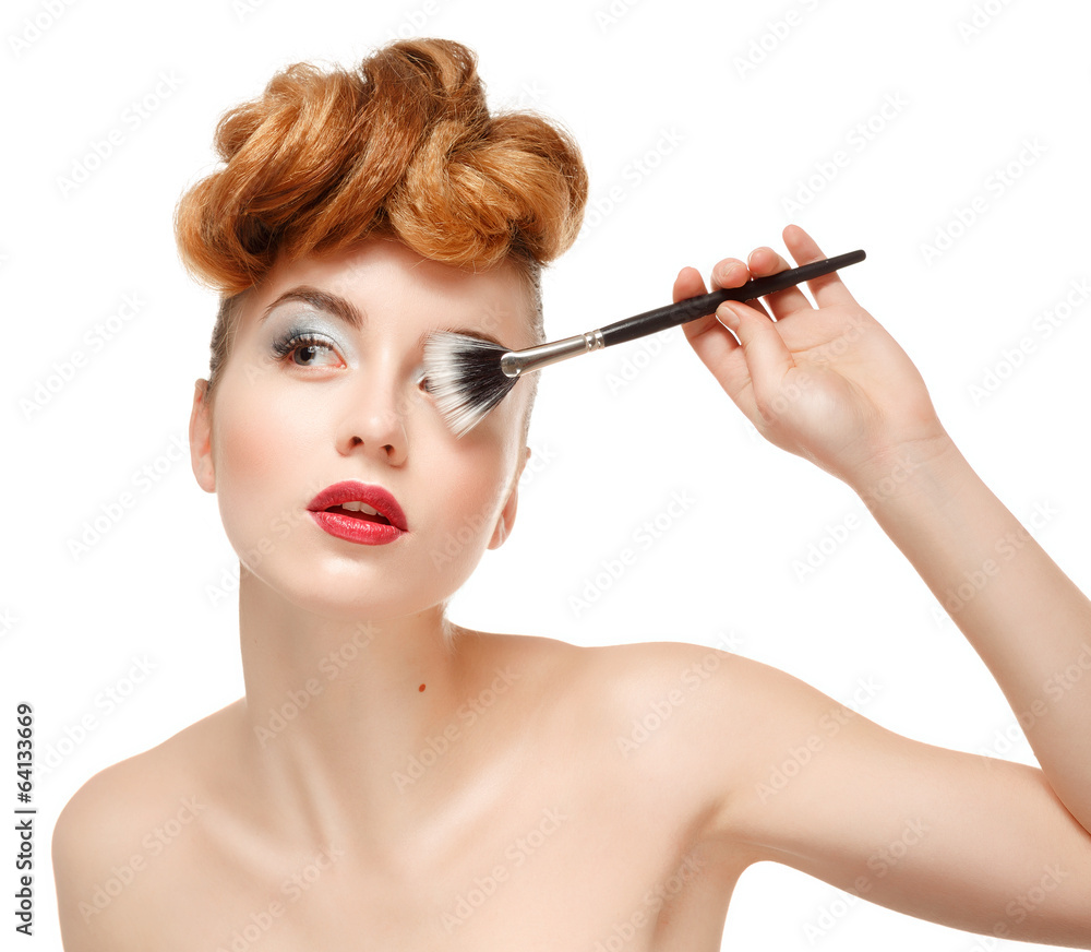 Fototapeta premium Beauty portrait of pretty woman with brush for makeup