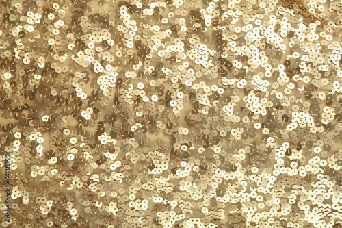 Golden sequins - sparkling sequined textile photo