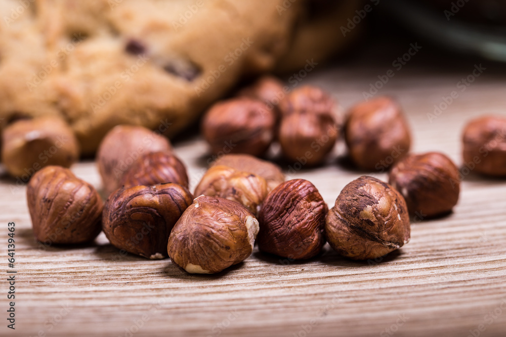 hazelnuts with chocolate crunchy cookies on the table hazelnuts with chocolate crunchy cookies on the table